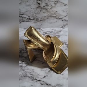 Gold Ego Heels size 7 but run bigger